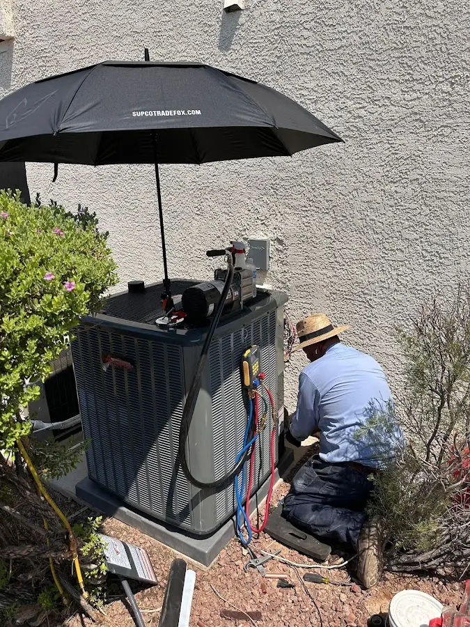 HVAC technician performing outdoor AC maintenance in Washington Court House